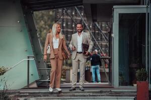 Modern business couple after a long day's work, walking together towards the comfort of their home, embodying the perfect blend of professional success and personal contentment. photo