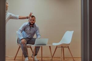Programmers have fun on a break from work while working together to solve various programming codes photo