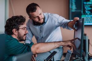 Programmers engrossed in deep collaboration, diligently working together to solve complex problems and develop innovative mobile applications with seamless functionality. photo
