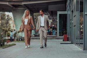 Modern business couple after a long day's work, walking together towards the comfort of their home, embodying the perfect blend of professional success and personal contentment. photo