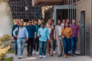 A diverse group of businessmen and colleagues walking together by their workplace, showcasing collaboration and teamwork in the company. photo