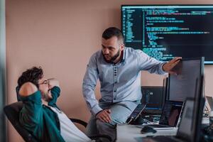 Programmers engrossed in deep collaboration, diligently working together to solve complex problems and develop innovative mobile applications with seamless functionality. photo
