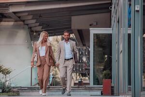 Modern business couple after a long day's work, walking together towards the comfort of their home, embodying the perfect blend of professional success and personal contentment. photo