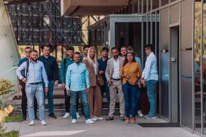 A diverse group of businessmen and colleagues walking together by their workplace, showcasing collaboration and teamwork in the company. photo