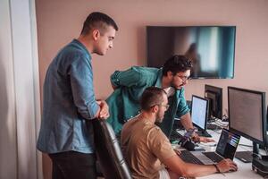 Programmers engrossed in deep collaboration, diligently working together to solve complex problems and develop innovative mobile applications with seamless functionality. photo