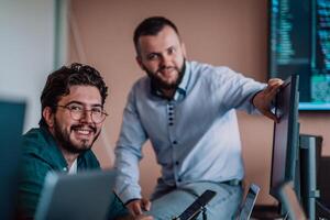 Programmers engrossed in deep collaboration, diligently working together to solve complex problems and develop innovative mobile applications with seamless functionality. photo