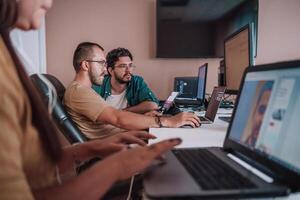 Programmers engrossed in deep collaboration, diligently working together to solve complex problems and develop innovative mobile applications with seamless functionality. photo
