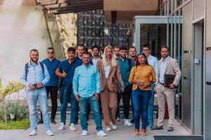 A diverse group of businessmen and colleagues walking together by their workplace, showcasing collaboration and teamwork in the company. photo