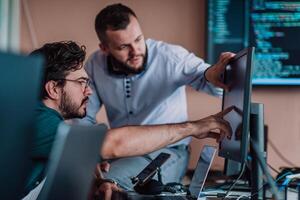 Programmers engrossed in deep collaboration, diligently working together to solve complex problems and develop innovative mobile applications with seamless functionality. photo