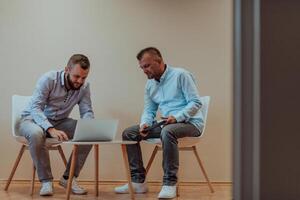 Programmers engrossed in deep collaboration, diligently working together to solve complex problems and develop innovative mobile applications with seamless functionality. photo