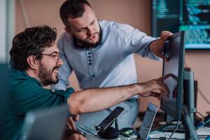 Programmers engrossed in deep collaboration, diligently working together to solve complex problems and develop innovative mobile applications with seamless functionality. photo