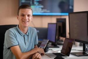 Innovating the Future. A Young Programmer Testing New Smartphone Apps in the Office. photo