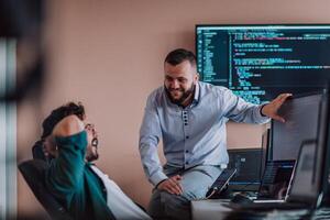 Programmers engrossed in deep collaboration, diligently working together to solve complex problems and develop innovative mobile applications with seamless functionality. photo