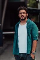 A portrait of a modern man, exuding confidence and style, against an outdoor backdrop, showcasing his charisma and fashionable demeanor. photo