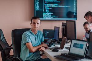 Programmers engrossed in deep collaboration, diligently working together to solve complex problems and develop innovative mobile applications with seamless functionality. photo