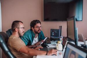 Programmers engrossed in deep collaboration, diligently working together to solve complex problems and develop innovative mobile applications with seamless functionality. photo
