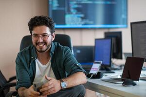 A programmer diligently testing smartphone applications photo