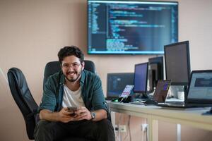 A programmer diligently testing smartphone applications photo