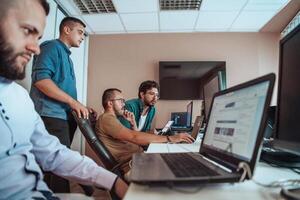 Programmers engrossed in deep collaboration, diligently working together to solve complex problems and develop innovative mobile applications with seamless functionality. photo