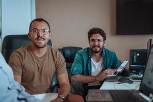 Programmers engrossed in deep collaboration, diligently working together to solve complex problems and develop innovative mobile applications with seamless functionality. photo