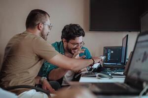 Programmers engrossed in deep collaboration, diligently working together to solve complex problems and develop innovative mobile applications with seamless functionality. photo