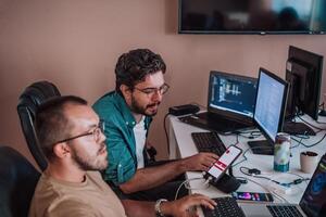 Programmers engrossed in deep collaboration, diligently working together to solve complex problems and develop innovative mobile applications with seamless functionality. photo