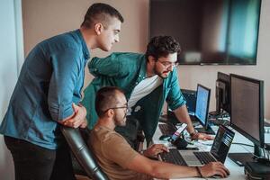 Programmers engrossed in deep collaboration, diligently working together to solve complex problems and develop innovative mobile applications with seamless functionality. photo