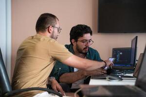Collaborative Minds. A Team of Programmers Tackling Challenges Together in the Office. photo