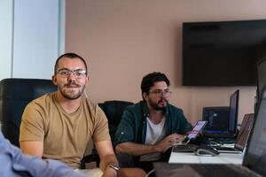 Collaborative Minds. A Team of Programmers Tackling Challenges Together in the Office. photo