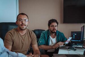 Programmers engrossed in deep collaboration, diligently working together to solve complex problems and develop innovative mobile applications with seamless functionality. photo