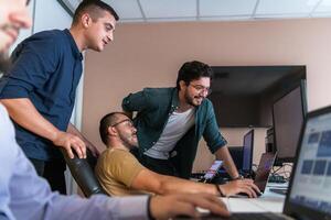 Collaborative Minds. A Team of Programmers Tackling Challenges Together in the Office. photo