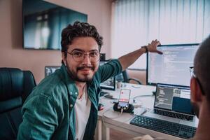 Programmers engrossed in deep collaboration, diligently working together to solve complex problems and develop innovative mobile applications with seamless functionality. photo