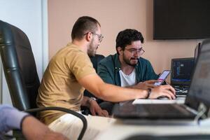 Collaborative Minds. A Team of Programmers Tackling Challenges Together in the Office. photo