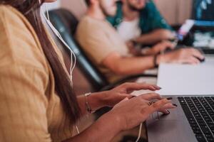 Close up image of woman hands typing on laptop computer keyboard and surfing the internet on office table, online, working, business and technology, internet network communication concept photo