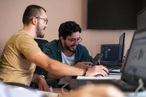 Collaborative Minds. A Team of Programmers Tackling Challenges Together in the Office. photo