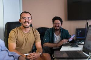 Collaborative Minds. A Team of Programmers Tackling Challenges Together in the Office. photo