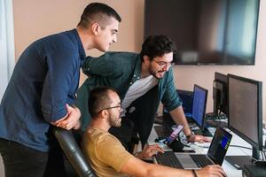 Collaborative Minds. A Team of Programmers Tackling Challenges Together in the Office. photo