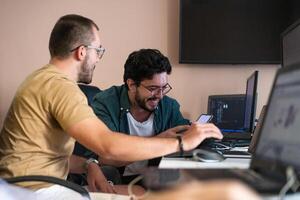 Collaborative Minds. A Team of Programmers Tackling Challenges Together in the Office. photo