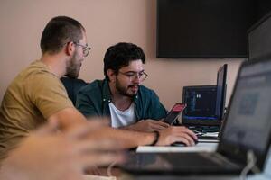 Collaborative Minds. A Team of Programmers Tackling Challenges Together in the Office. photo