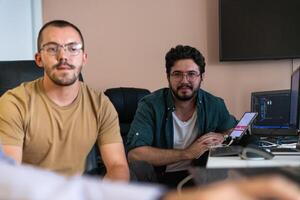 Collaborative Minds. A Team of Programmers Tackling Challenges Together in the Office. photo