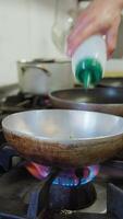 Chef Is Adding Extra Virgin Olive Oil Into The Pan Of A Restaurant video