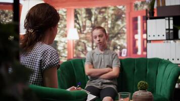 Rebellious teenager with an attitude discussing with therapist about her mental health issues, aggressive intrusive thoughts. Girl with murder behavior and anger management issues. Camera B. video