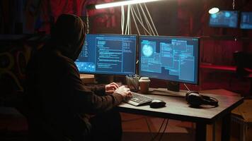 Hacker in underground bunker takes advantage of security breach after gaining unauthorized access to system. Rogue programmer hacking network to steal government data, zoom in close up shot video
