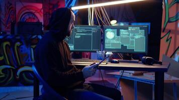 Hackers doing computer sabotage using encryption trojan ransomware on tablet. Cybercriminals use device to demand ransom money from victims in exchange for access to their data, zoom in shot video