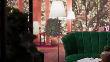 Empty luxurious counseling cabinet designed with many objects to create a cozy atmosphere for clients. Psychology office used for therapy sessions with high end decorations, rehabilitation. video