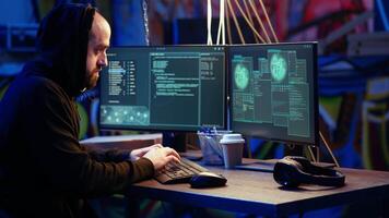 Hacker in hidden base excited after successfully getting past anti tamper measures implemented by companies to protect their products. Joyous cracker celebrating after managing to pirate software video