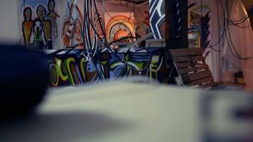 Empty messy criminals base of operations with graffiti drawings sprayed on walls. Electric cables hanging in derelict ghetto hideout used by vandals to commit illegal activities. video