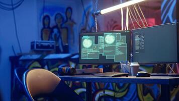 Hacker arriving in secret underground base with SSD containing data from victim after tricking it into installing ransomware program he developed. Man satisfied with his criminal plan, camera A video