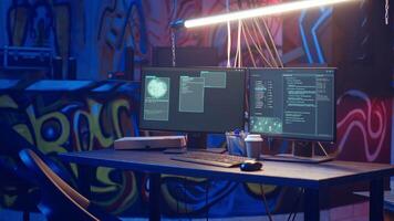 Hooded hacker arriving in hidden underground shelter, prepared to launch DDoS attack on websites. Cybercriminal starting work on script that can crash businesses servers, camera B video