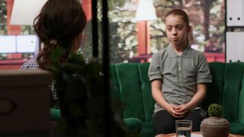 Teenager in a counseling session focused on emotional management and self esteem issues. Adolescent seeks guidance on overcoming trauma and intrusive thoughts, hormonal shifts. Camera A. video